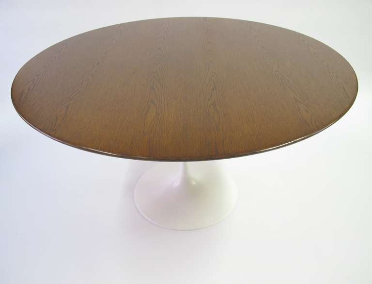 Eero Saarinen Tulip Dining Table by Knoll.
The Oak top is 48”. The white enameled base is 28.5” tall.

This item is located in our Brooklyn New York warehouse.