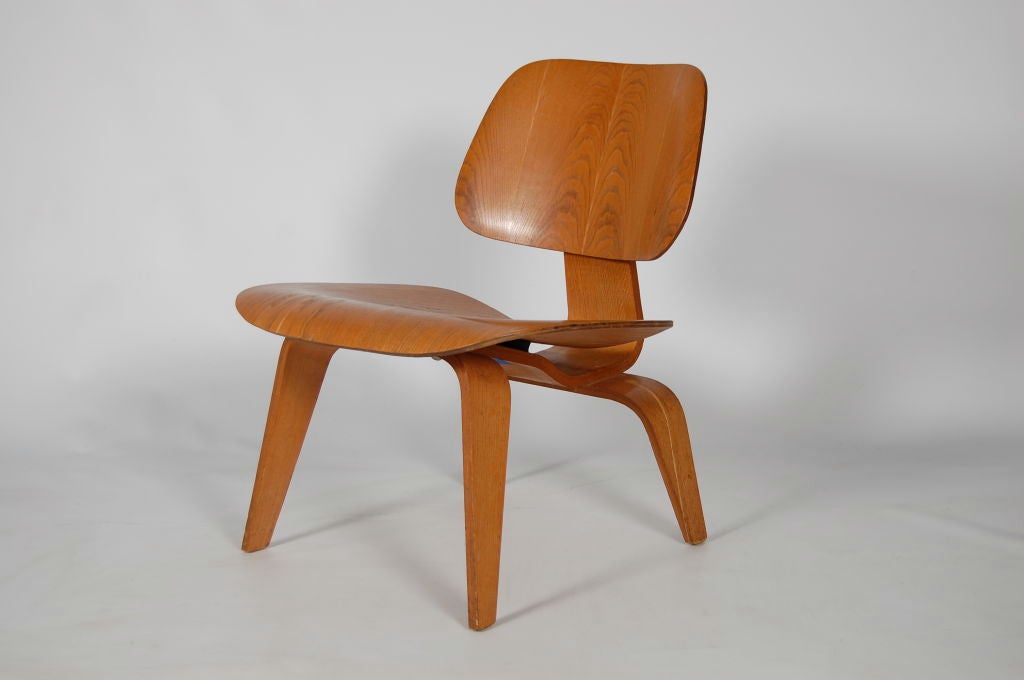 Charles and Ray Eames for Evans Products , an original vintage LCW ( Lounge Chair Wood ) , early five screw configuration dates this chair to the late 40's .