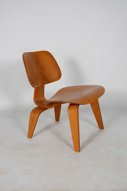 Charles and Ray Eames for Evans/Herman Miller , vintage LCW (Lounge Chair Wood ) , nice vibrant veneer grain , 5 screw configuration to front legs making this an early example .