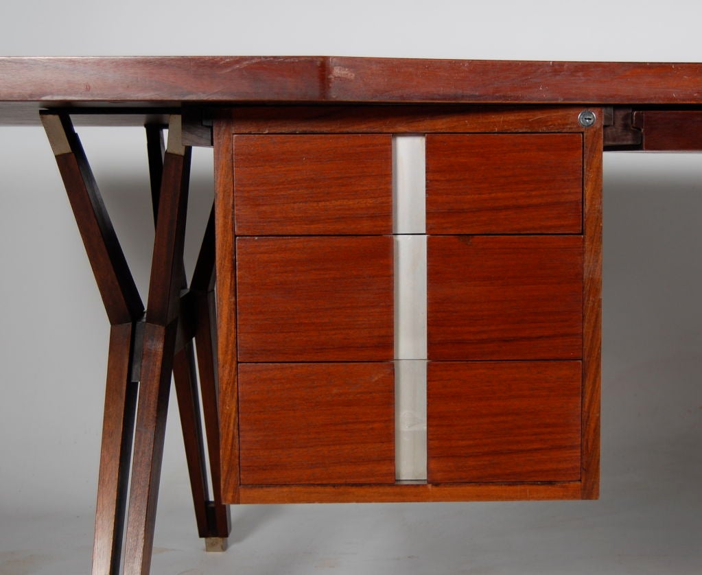 Ico Parisi for MIM (Mobili Italiano Moderni) , Rosewood desk with top of sculpted form , drawer module with bank of 3 to the front and 2 to the rear allowing it to be used as a partners desk if desired . Central pencil drawer and the very rare side