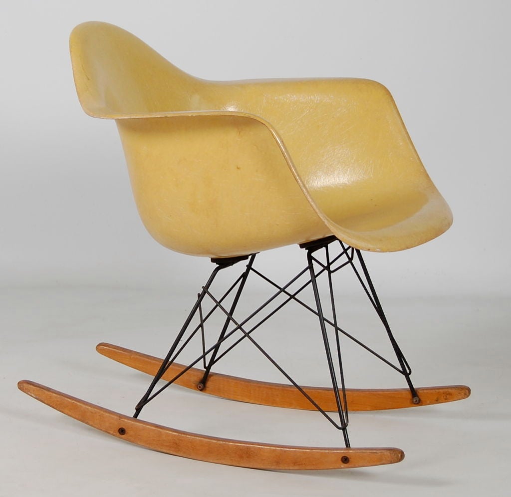 Charles and Ray Eames for Zenith/Herman Miller an RAR ( Rocking Armshell Rod base ) , fibreglass shell with large shockmounts but no rope edge , so a transitional example in production for  around 1 year , base all original with nicely patinated