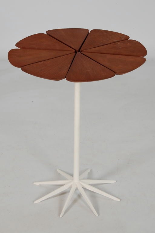 Richard Schultz for Knoll , a Petal end table consisting of eight redwood leaves over cast metal base with original white paint . Knoll label to underside .