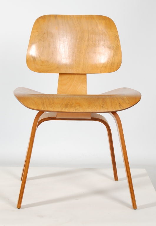 A Charles and Ray Eames vintage DCW ( Dining Chair Wood ) , vintage 1950's production with original shockmounts and hardware . 3 available