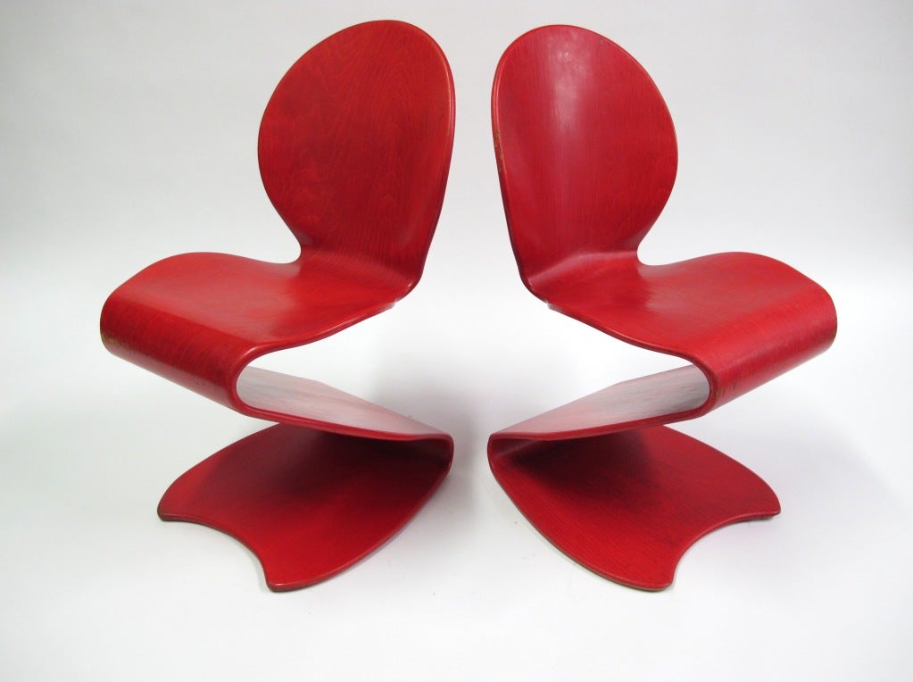 A rare pair of S-Stuhls Chairs, model 276, in red aniline die.  These chairs were made by Thonet and have manufactures labels under the seats.  This is a fantastic form that accentuates the use of molded plywood.  The bright red aniline die shows