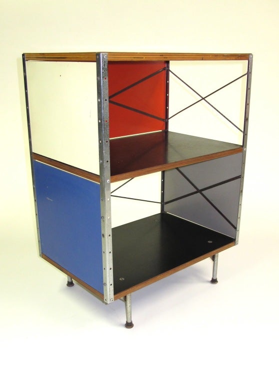 This Eames Storage Unit is in very good original condition.  The top is finished in Birch Veneer.  The Masonite panels have bright color. This unit is complete and has a label on the upper inside panel.  
This item is located in our Brooklyn