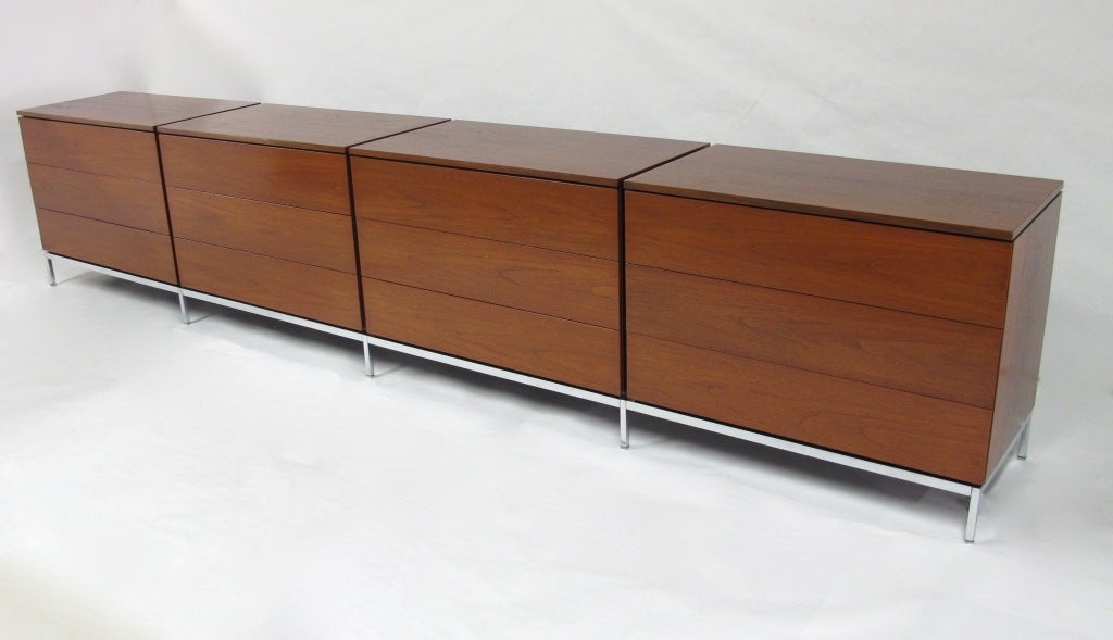 Quadruple dresser made of teak veneer with a brushed steel base.   This extremely rare configuration is in excellent condition.  The 4 sections rest on one base.  Each section features drawer dividers.
This item is located in our New York