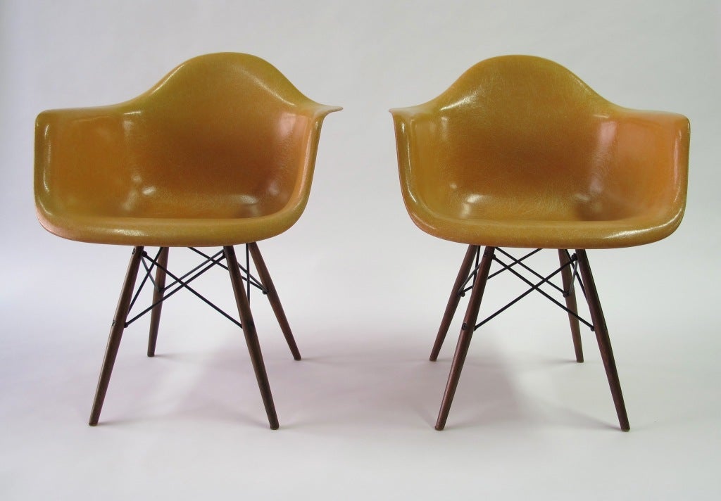 Cantaloupe colored second-generation Zenith Plastics seats with original walnut dowel bases.  This is a very nice set in excellent original condition.  The chairs are labeled.
Located in our New York warehouse.