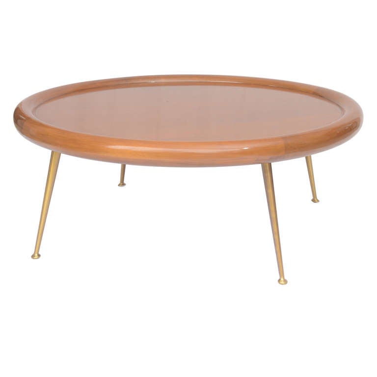 Elegant walnut coffee table with brass legs designed by T H Robsjohn-Gibbings for Widdicombe.