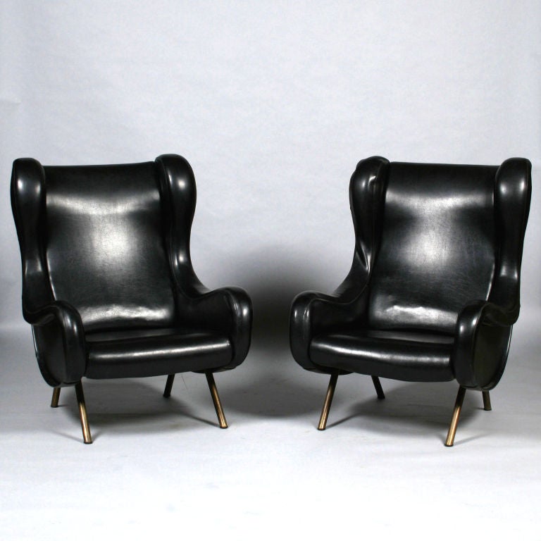 Pair of sought after armchairs by Marco Zanusso, Model 'Senior', produced by Arflex. Reupholstered in black vinyl. Arflex, label to base.