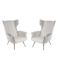 Pair of upholstered Italian wing chairs Pair of upholstered Italian wing chairs