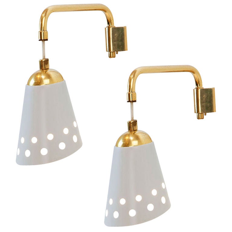 Pair of  white lacquered metal and brass wallights by Osvaldo Borsani.<br />
Item location: London