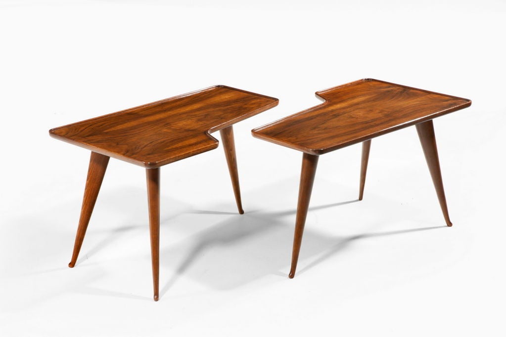 Pair of shaped walnut tables designed by Gio Ponti.