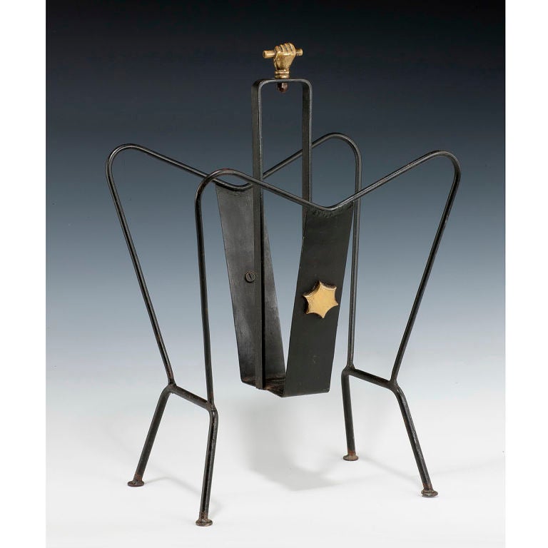 Lacquered metal magazine rack by Jacques Adnet<br />
Item location: London