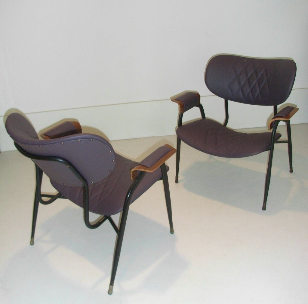 Pair of lacquered metal chairs with wooden arms reupholstered in leather. Four examples available. Designed by Rima.<br />
Item location: New York and London     <br />
<br />
Mario Rinaldi (1891-1969) founded his company Rima in 1920,