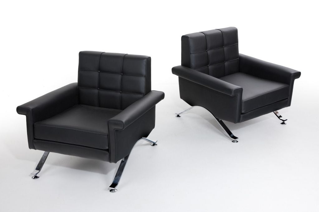 Pair of armchairs designed by ico Parisi reupholstered in leather.