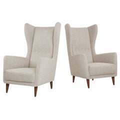 Pair of upholstered armchairs designed by Gio Ponti.