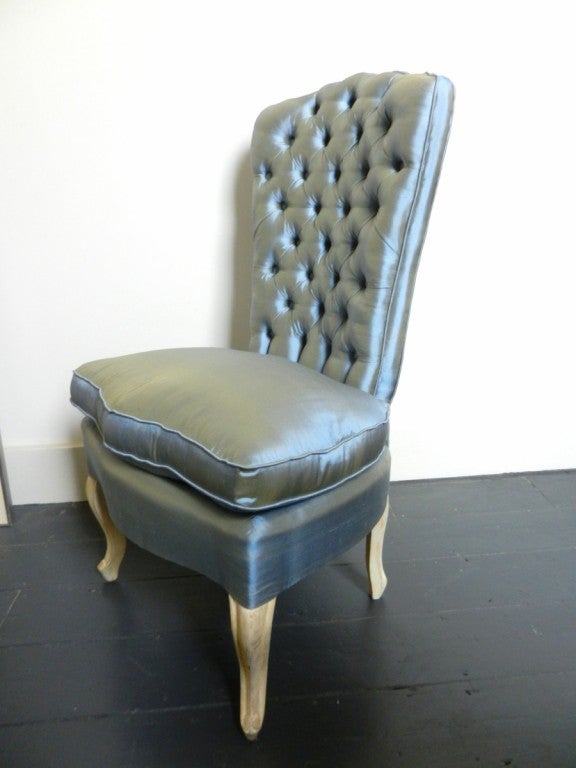 Unusual high backed French slipper chair in rococco style with gessoed cabriolet legs. Reupholstered in blue silk.