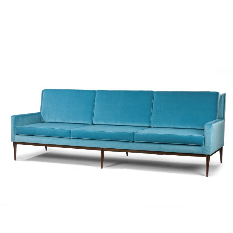 Large sofa by Paul McCobb, reupholstered in velvet. Label to underside.