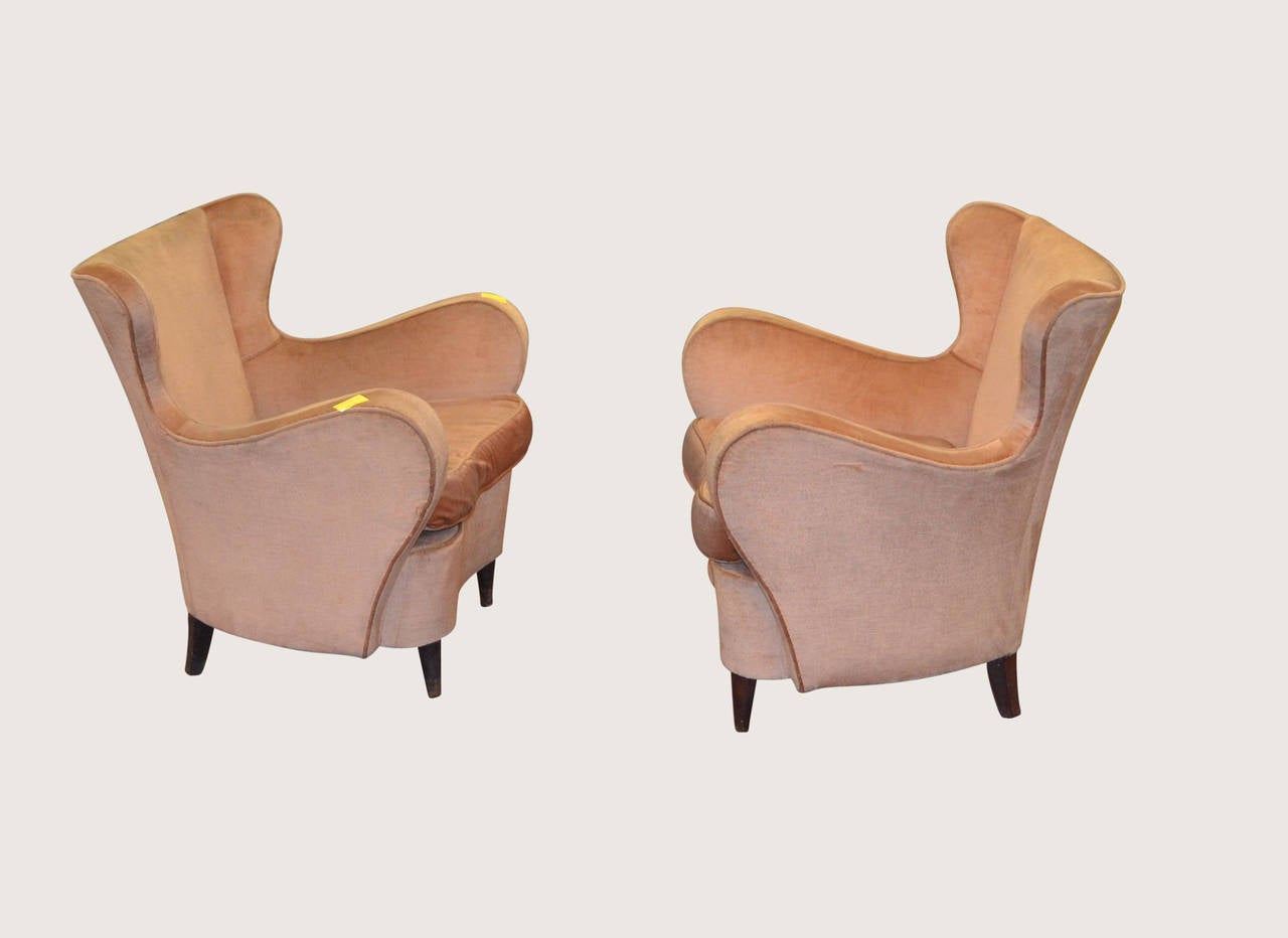 Pair of wonderfully curvaceous Italian armchairs, circa 1950.
These chairs will need to be re-upholstered.