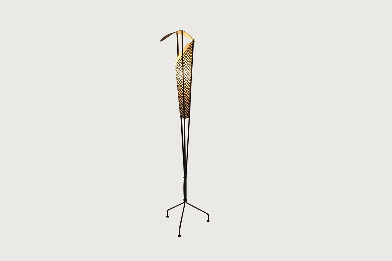 Enameled and perforated metal floor lamp designed by Jacques Biny
for Luminalite, France. This lamp has a new paper shade and has, 
been re-wired for the UK.