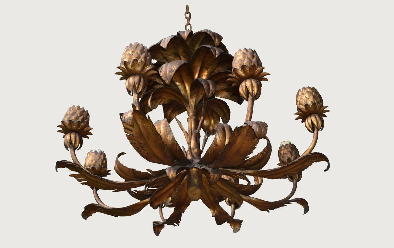 Gilded metal eight-branch pineapple chandelier,
France, circa 1940.