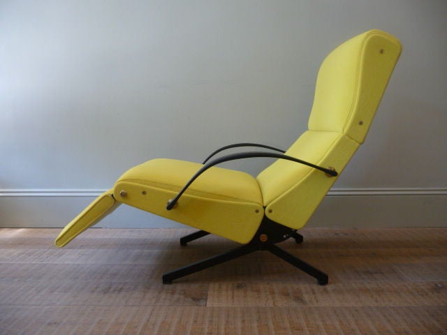 the borsani p40 lounge chair manufactured by 'tecno' articulates to over 30 different seating and reclining positions.