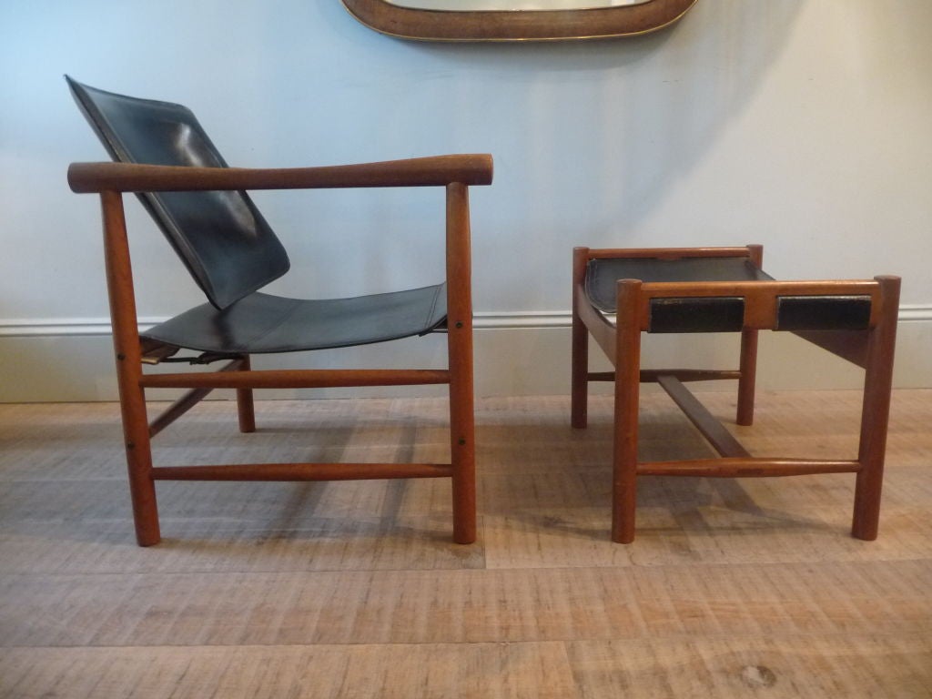 teak and stitched leather model '506' safari chair and ottoman designed by kai lyngfeldt larsen and manufactured by soborg mobler c.1959, label to underside.