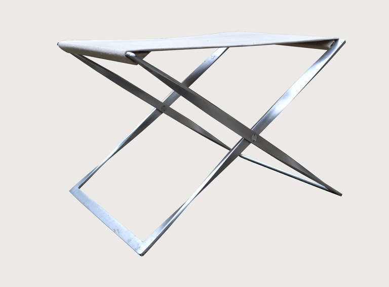 Matt chromed steel and canvas Pk91 folding stool
designed by Poul Kjaerholm and manufactured by
Fritz Hansen , Denmark c,1980.