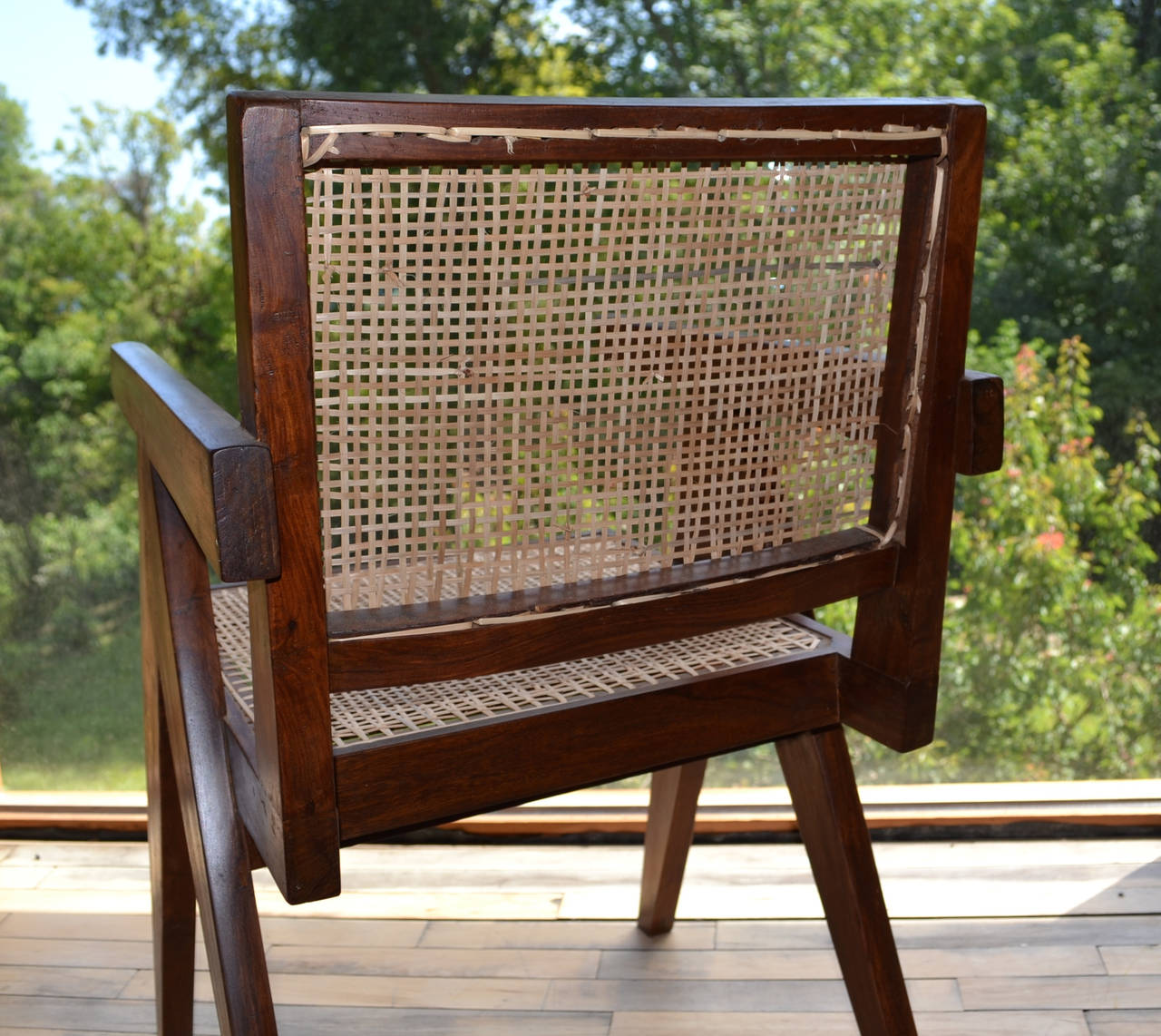 Teak and cane armchair designed by Pierre Jeanneret for the 
city of Chandigarh , India.