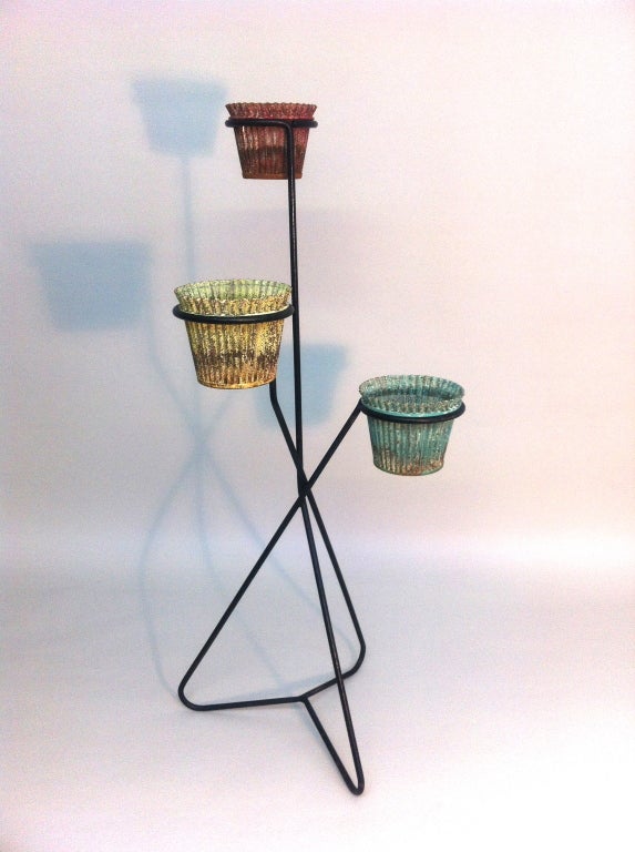 Mathieu Mategot wrought iron plant stand with three baskets retaining their 
original paint.