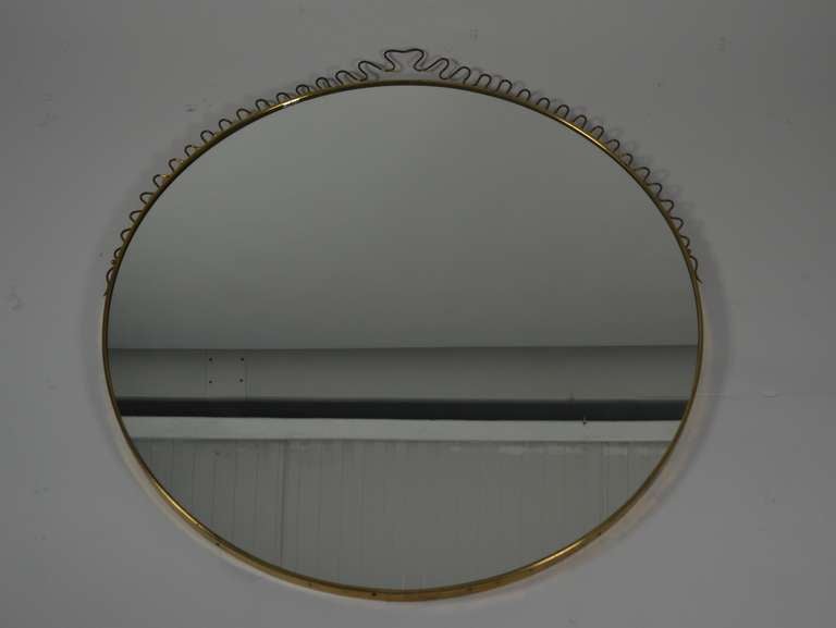 Lacquered brass Italian mirror with wire work decoration.