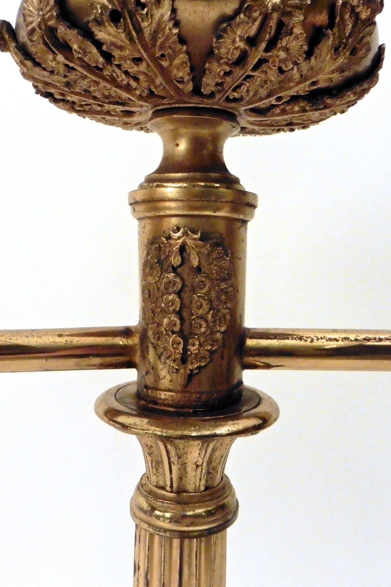 An elegant pair of William IV twin-light oil lamps in gilt bronze, circa 1840. Finely cast and chased and bearing impressed label for Williams & Bach, New Bond Street, London. Later shades, wired UK.