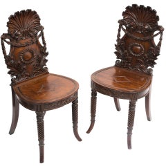 Pair Irish 19thC  Highly Carved Mahogany Hall Chairs with Shell Backs c1850
