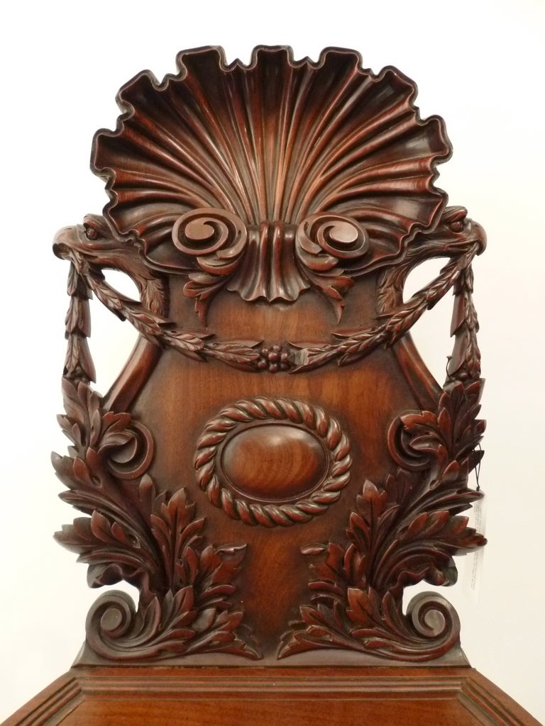 Pair Irish 19thC  Highly Carved Mahogany Hall Chairs with Shell Backs c1850 In Good Condition In London, GB