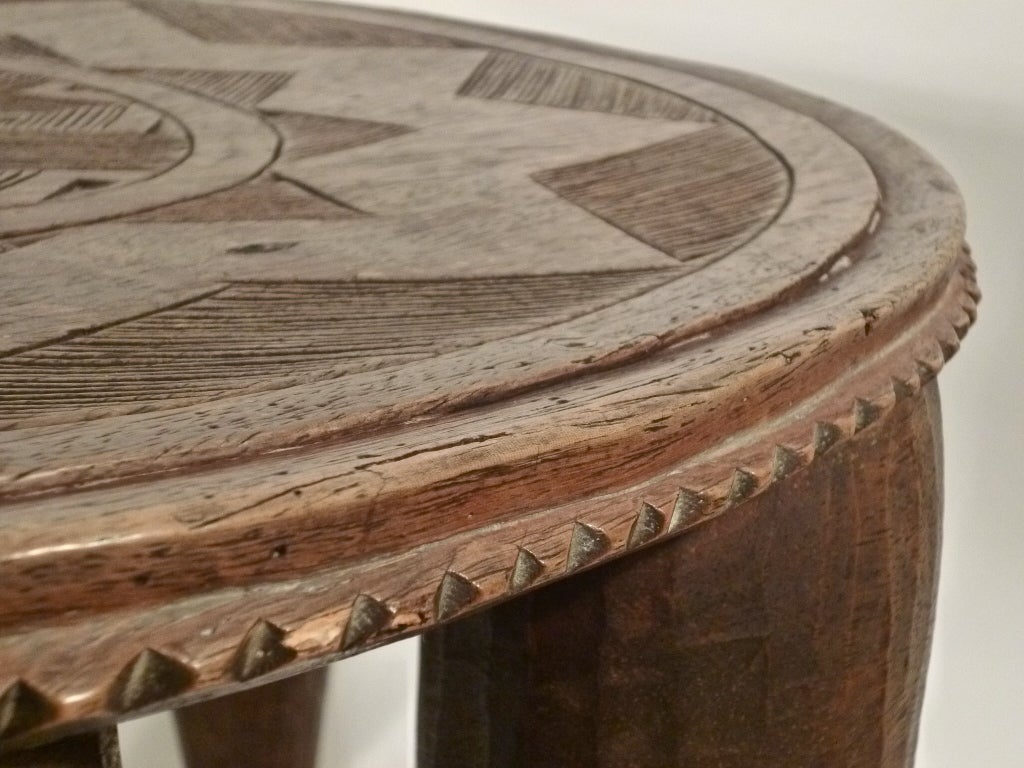 nupe tribe Eight bold, tapered legs support this sturdy, carved wood stool crafted by the nupe tribe in nigeria the top features a craved starburst pattern, adding even more interest to an already captivating piece. nupe tribe Eight bold, tapered legs support this sturdy, carved wood stool crafted by the nupe tribe in nigeria the top features a craved starburst pattern, adding even more interest to an already captivating piece.