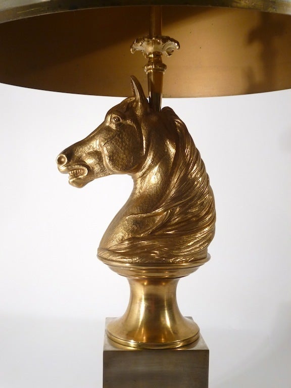 Pair French Gilt Brass & Silvered Horse Head Table Lamps by Maison Charles. The lamps are stamped Made in France, Charles with original metal shades. 
The heads are cast in realistic detail, displaying their bared teeth, flared nostrils and flowing