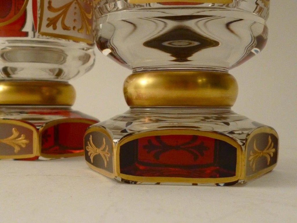 Set of Six Cut Glass Bohemian Goblets with Flashed ruby panels and gilt decoration, on hexagonal bases, makers mark underside.