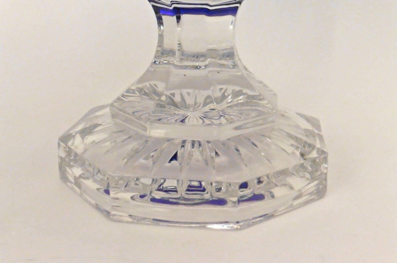 A fine quality cut clear and blue crystal Saint Louis bowl, the bowl in flashed blue glass in a repetitive modern design. With a diamond cut band around the base of the bowl, supported by an octagonal foot. Stamped by the makers, circa 1950.