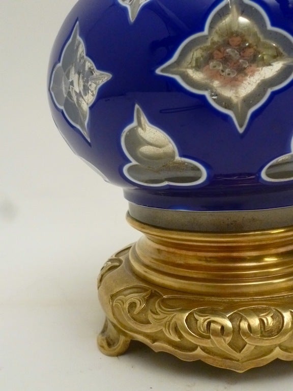 Pair of Bohemian Glass Lamps with Brass Chinese Style mounts.
The clear glass bodies overlaid in white and blue glass, silvered in the inside.
Shades not included.