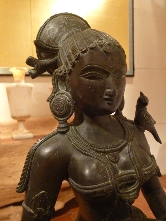 Indian bronze statue of Goddess Lakshmi, also known as Deepa Lakshmi. Lakshmi is the Hindu goddess of wealth, prosperity (both material and spiritual), fortune and the embodiment of beauty. It is also said that she brings good luck and protects her