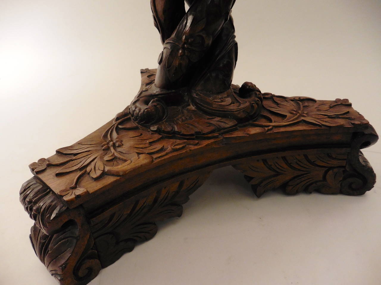 A rare and unusual Anglo-Indian highly carved rosewood tripod stand, circa1860. With open barley twist column and richly carved throughout with floral and foliate ornamentation. The top inset with later marble.