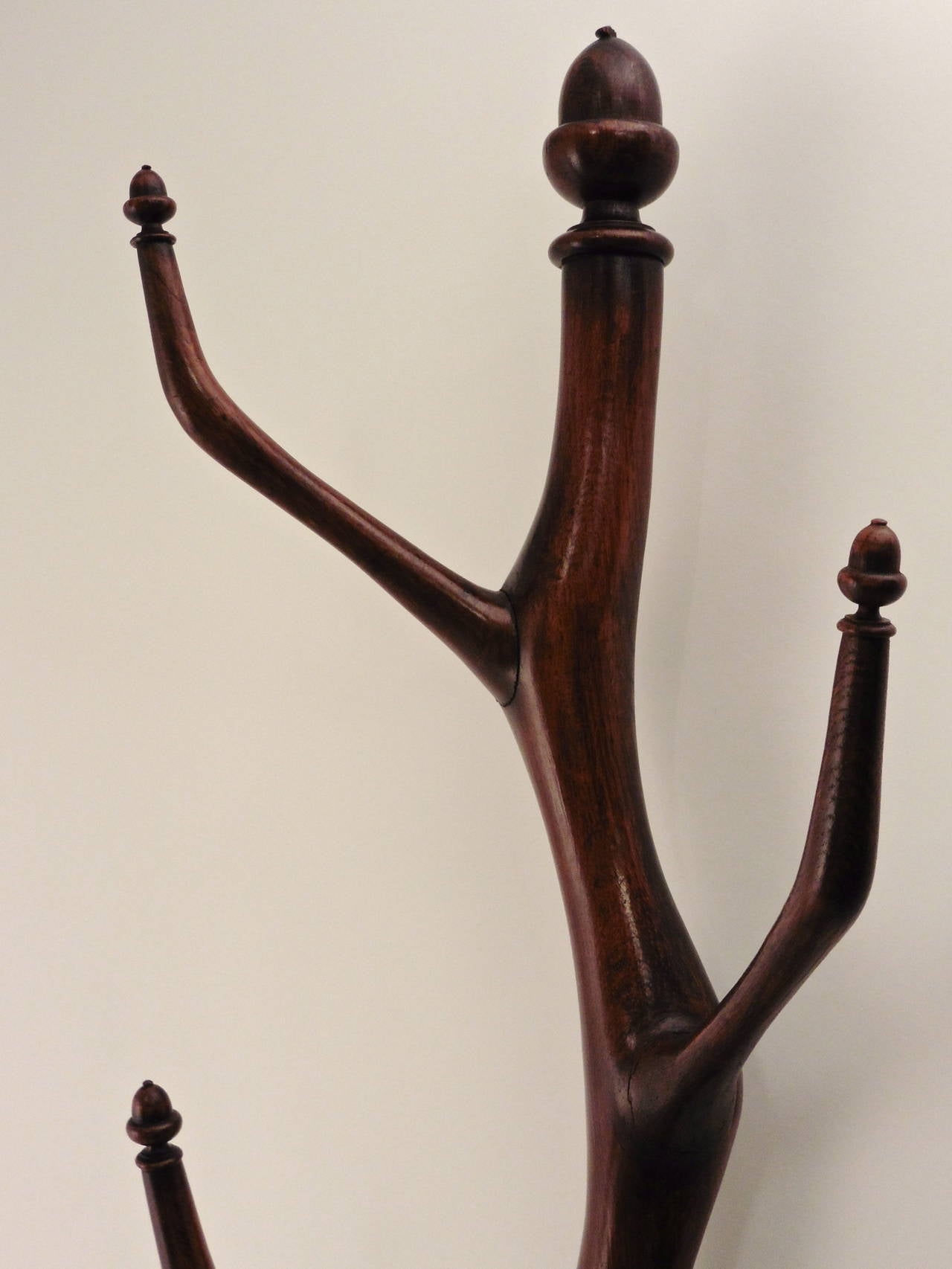 A wonderful French Provincial carved oak organic form hat stand tree with acorn motifs at the tip of each of the eight alternating branches and similarly topped with a large acorn finial, circa 1880.