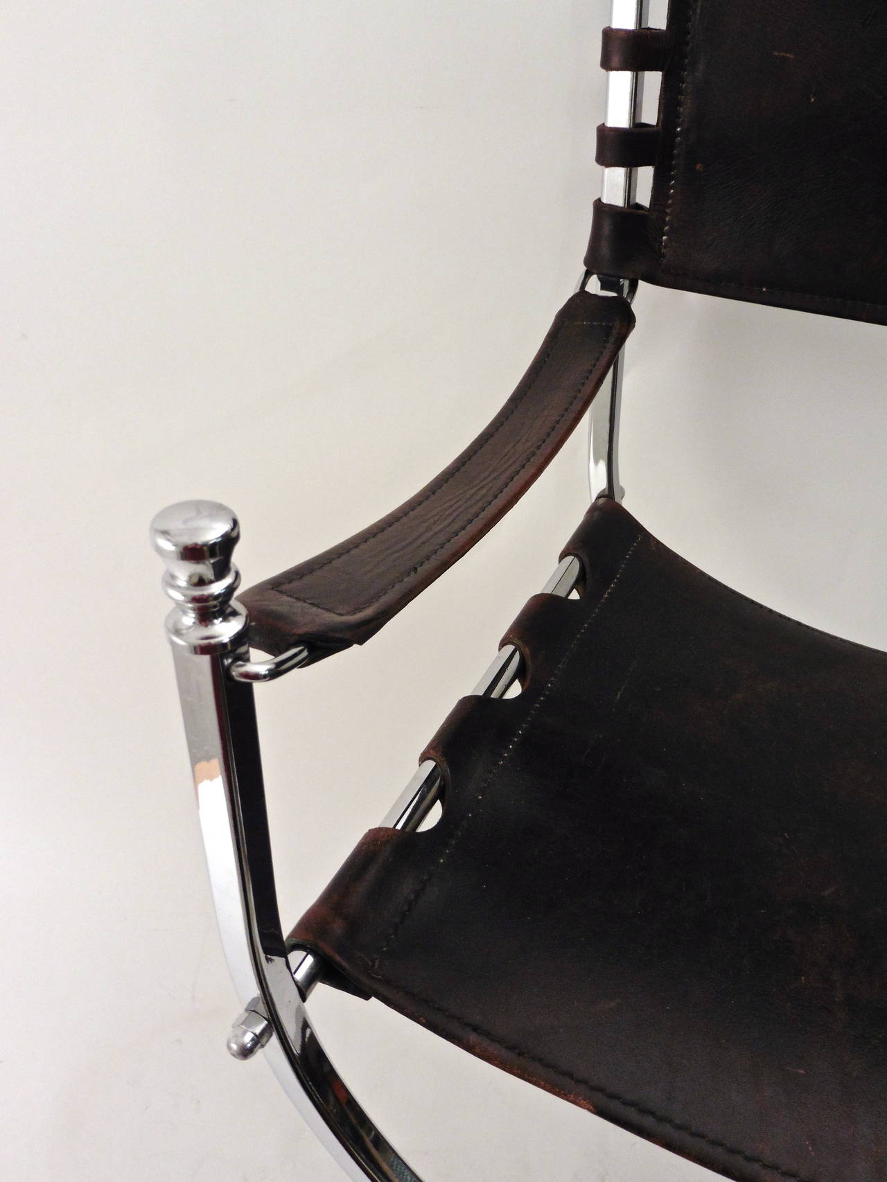 Sensational set of four Curule shaped chrome armchairs. With wonderful thick saddle leather seats, backs and armrests. Manufactured by Maison Jansen, France, circa 1970.