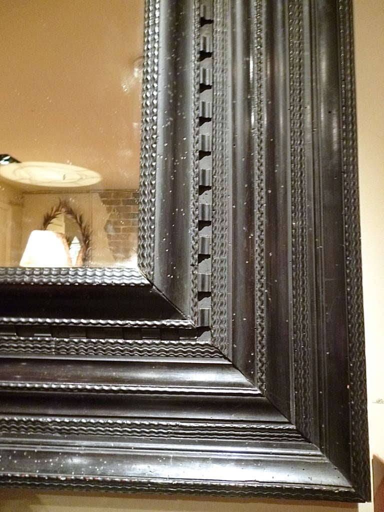 Italian 18th Century Ebonised Ripple Moulded Cushion Frame Mirror