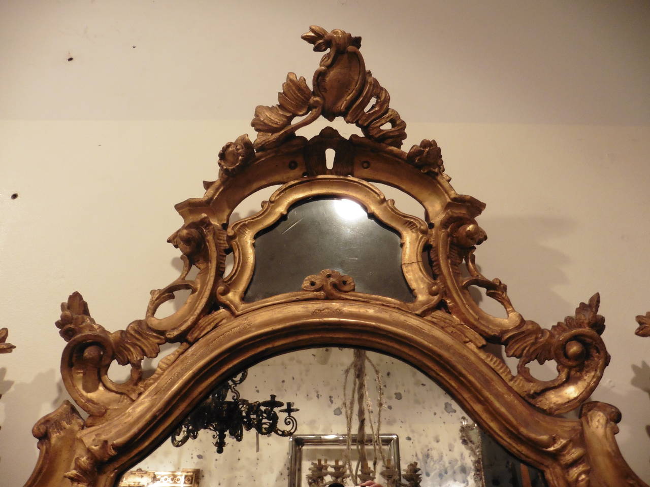 A very fine pair of Italian Venetian giltwood frame shield shaped mirrors “A Parecloses