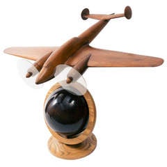 Vintage English Carved Wood Model of a Twin Engine Plane on a Globe Mid 20th Century