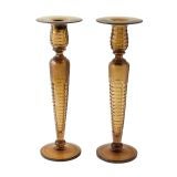 An Impressive Pair of Amber Candlesticks by H.P. Sinclaire