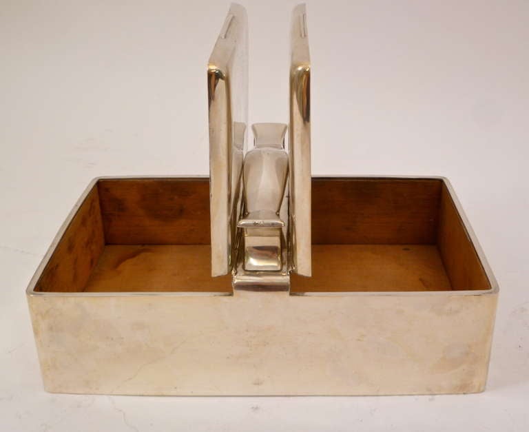 An extremely elegant silver twin compartment cigar or cigarette box with carrying handle. The interior lid partially gilded and bearing an inscription, the main compartments lined in cedar wood. Hallmark for Birmingham 1921 and makers mark for H.