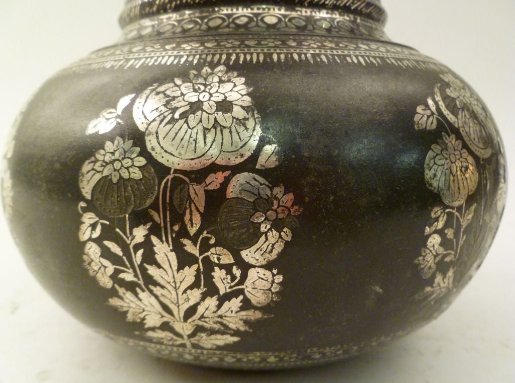 Bidriware Vase, decorated with silver flowers. Early 19th Century, from Bidar, Karnataka, India.<br />
<br />
Bidriware is a metal handicraft that originated in Bidar, Karnataka, in the 14th century C.E. The term 'Bidriware' originates from the