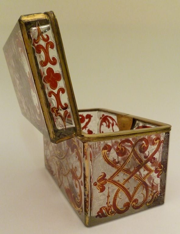 Rectangular Bohemian glass casket with flashed red and applied gilt decoration.